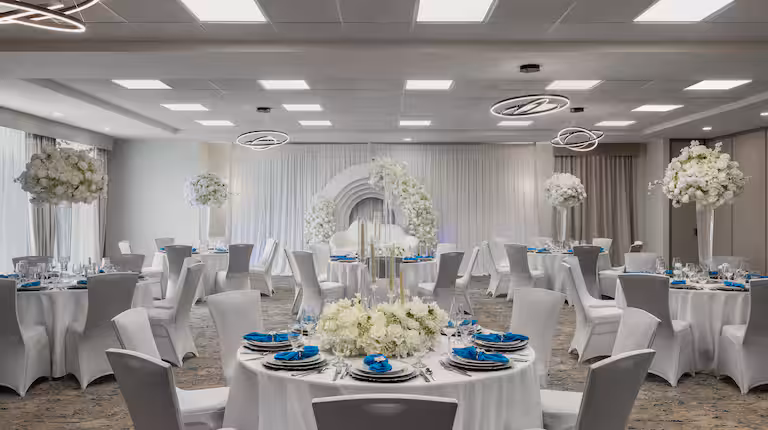 Hotel ballroom set with round tables for a banquet